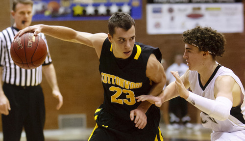 Trent Nelson  |  The Salt Lake Tribune
Cottonwood's Ryan Mackay controls the ball, with Highland's Todd Connolly defending, as Highland faces Cottonwood High School, boys basketball in Salt Lake City, Utah, Thursday, December 22, 2011.