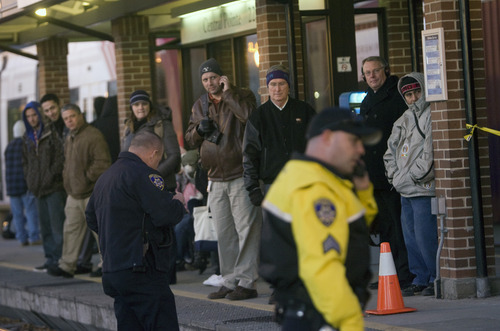 Kim Raff |The Salt Lake Tribune
Passengers watch as South Salt Lake and UTA Police investigate an accident on the southbound red line at the UTA Trax Central Pointe Station in South Salt Lake City, Utah on January 12, 2012.