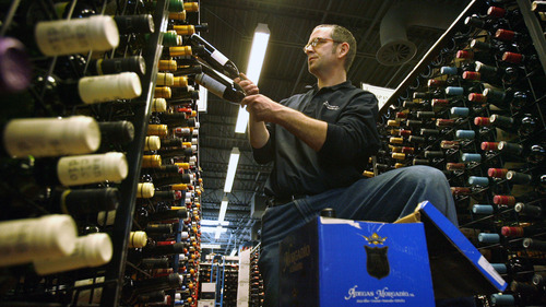 Steve Griffin  |  The Salt Lake Tribune
Warren McClain stocks bottles of wine at the State Wine Store at 280 W. Harris Ave in Salt Lake City on Thursday.