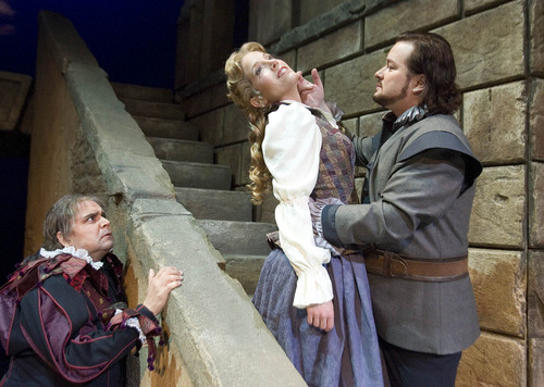 Paul Fraughton | The Salt Lake Tribune.
 Guido LeBron as Rigoletto, Celena Shafer as Gilda and Robert McPherson as The Duke of Mantua in the Utah Opera production of Verdi's 