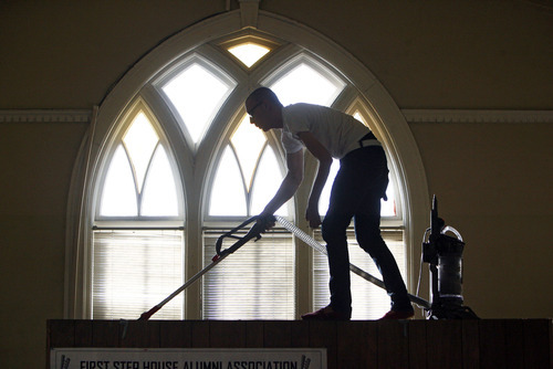 Francisco Kjolseth  |  The Salt Lake Tribune
Volunteer Justin Brown takes the vacuum where few have ventured above the library in the chapel at the substance abuse treatment center, First Step House in Salt Lake City on Saturday, January 14, 2012.  University of Utah's Lowell Bennion Community Service Center and Black Student Union host the annual Martin Luther King Jr. Day of Service. Volunteers split up to do four different service projects around the city, including at the First Step House on Grant Street.