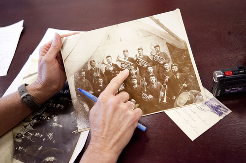 Jeremy Harmon  |  The Salt Lake Tribune

Colleen Loveless, the great-grandaughter of Ulysses W. Grange, looks at a photo of him with and his bandmates in the Huntington Band. The photo was taken in 1895 and had been sitting in the Tribune's archives since 1947 after it had been sent to the paper by Loveless's great-aunt Ruby Morgan. The Tribune returned the photo to the family on Thursday, January 12, 2012. Grange is on the back row, second from the right.