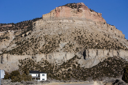 Jeremy Harmon  |  The Salt Lake Tribune

Cliffs dwarf Kenilworth, Utah, on Thursday, January 12, 2012. Kenilworth was a mining town and at its peak in 1947 there were a little more than 1,000 residents.
