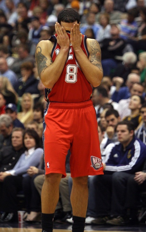 Kim Raff  | The Salt Lake Tribune
New Jersey Nets player Deron Williams wipes sweat off his face during Jazz free throws during the first half against the Utah Jazz at EnergySolutions Arena in Salt Lake City on Saturday.