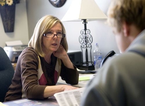 Al Hartmann  |  The Salt Lake Tribune
Lone Peak High School counselor Valerie Ross checks a student's class schedule to make sure they are on track to fulfill graduation requirements  She also informs students of scholarships and college opportunites.
