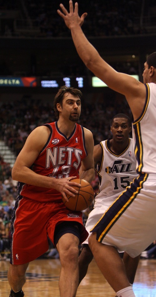 Kim Raff |The Salt Lake Tribune
New Jersey Nets player Mehmet Okur goes up for a layup as Utah Jazz player Enes Kanter defends during the second half at the Energy Solutions Arena in Salt Lake City, Utah on January 14, 2012.