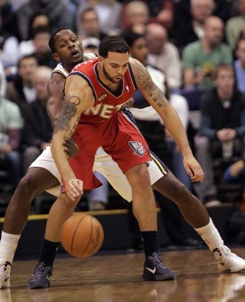 Kim Raff |The Salt Lake Tribune
Utah Jazz player C.J. Miles defends New Jersey Nets player Deron Williams during the first half at the Energy Solutions Arena in Salt Lake City, Utah on January 14, 2012.  The Jazz went on to win 107-94.