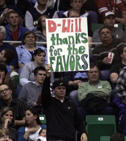 Kim Raff |The Salt Lake Tribune
A fan hold signs about former Jazz and current New Jersey Nets player Deron Williams during the second half at the Energy Solutions Arena in Salt Lake City, Utah on January 14, 2012.