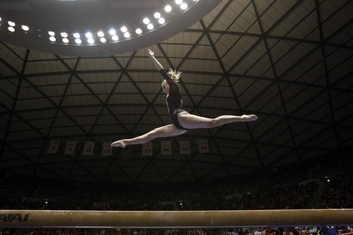 Chris Detrick  |  The Salt Lake Tribune
Mary Beth Lofgren competes on the beam during the gymnastics meet against Utah State at the Huntsman Center Friday January 13, 2012.