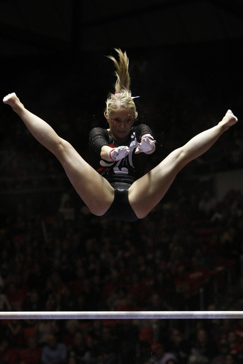 Chris Detrick  |  The Salt Lake Tribune
Kyndal Robarts competes on the bars during the gymnastics meet against Utah State at the Huntsman Center Friday January 13, 2012.