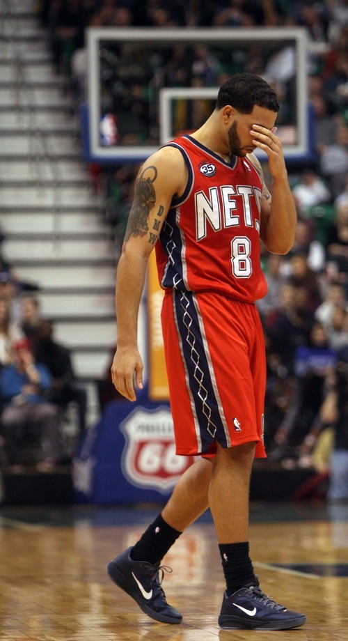 Kim Raff |The Salt Lake Tribune
New Jersey Nets player Deron Williams rubs his face after getting hit in the eye during the second half at the Energy Solutions Arena in Salt Lake City, Utah on January 14, 2012.    The Jazz went on to win 107-94.