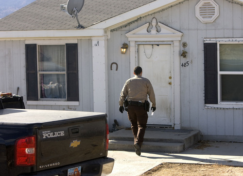 Al Hartmann  |  The Salt Lake Tribune
Mount Pleasant police and San Pete County Sheriff deputies search a home in Moroni along Highway 132 on Tuesday where Logan MacFarland lived. He is a suspect in the Dec. 30 killings of Leroy and Dorotha Fullwood.