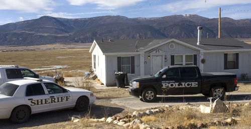 Al Hartmann  |  The Salt Lake Tribune
Moroni police and San Pete County Sheriff deputies search a home in Moroni along Highway 132 on Tuesday where Logan MacFarland lived. He is a suspect in the Dec. 30 killings of Leroy and Dorotha Fullwood.