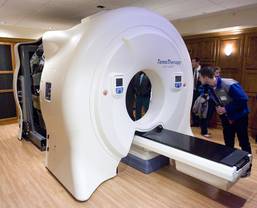 Rick Egan  | The Salt Lake Tribune 
Guests check out the Gamma West Cancer Services' TomoTherapy machine during an open house Friday at St. Mark's Hospital to showcase new image-guided radiation therapy technology.