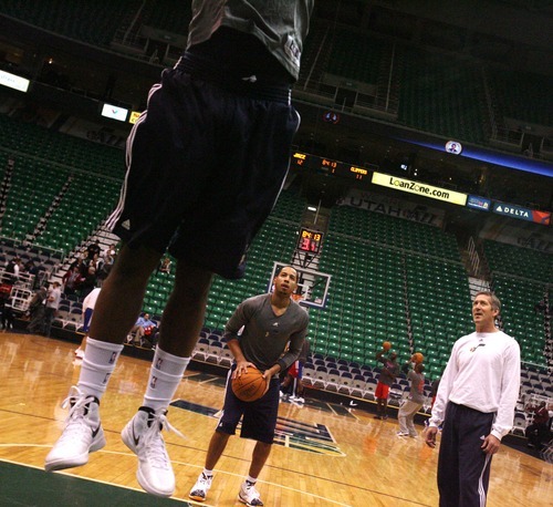 Steve Griffin  |  The Salt Lake Tribune


Utah's C.J. Miles leaps up and dunks the ball as Devin Harris shoots free throws during pre game warm-up of the Jazz versus Clippers game at EnergySolutions Arean in Salt Lake City, Utah  Tuesday, January 17, 2012.