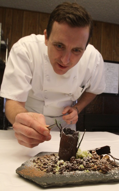 Rick Egan  | The Salt Lake Tribune 

Chef Gavin forms a landscape out of Amano chocolate in his test kitchen, Thursday, Dec. 15, 2011.  Baker, who has worked in top restaurants in London, New York City and Los Angeles, has hand-picked Utah culinary students to help him create and serve 15-course meals that cost $150 and last between three and four hours.