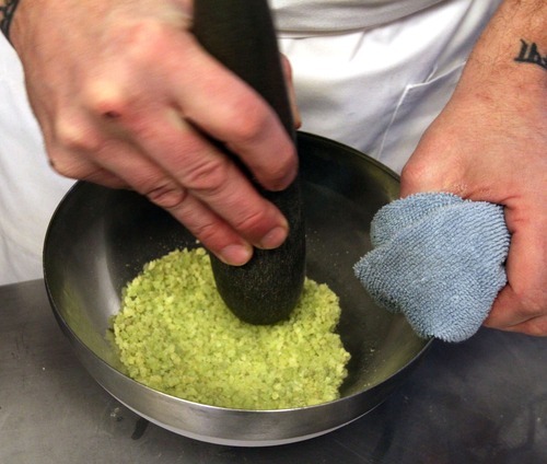Rick Egan  | The Salt Lake Tribune 
Chef Gavin Baker stirs a pistachio sponge cake mixed with liquid nitrogen into a bowl in his test kitchen. The Mist Project, his 
