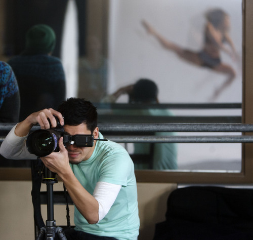 Trent Nelson  |  The Salt Lake Tribune
Chris Peddecord is a dancer who also specializes in photographing dancers. Peddecord photographed Kimberly Martin (in reflection) and other performers from Odyssey Dance Theatre at The Point Performing Arts Academy in Highland on Friday, Dec. 16, 2011.