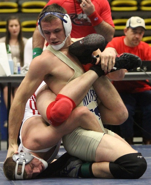 Rick Egan  | The Salt Lake Tribune 

Brandon Fisher, Shadow Ridge (gold) wrestles Ryan Peterson, Delta, (white), in the195 lb division, in The Rocky Mountain Rumble wrestling tournament in Orem, Saturday, January 14, 2012.