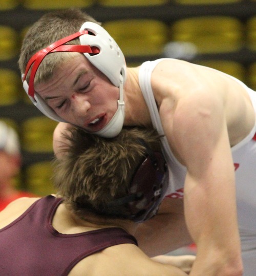 Rick Egan  | The Salt Lake Tribune 

Tyler Nielsen, Delta (white) wrestles Kimball Bastian, Maple Mountain, (maroon) in the152 lb division, in The Rocky Mountain Rumble wrestling tournament in Orem, Saturday, January 14, 2012.