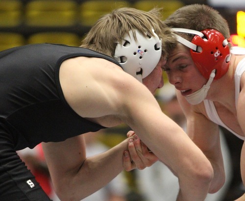 Rick Egan  | The Salt Lake Tribune 

Dane Nielson, Delta (white) wrestles Austin Dewey, Centennial,  in the160 lb division, in The Rocky Mountain Rumble wrestling tournament in Orem, Saturday, January 14, 2012.