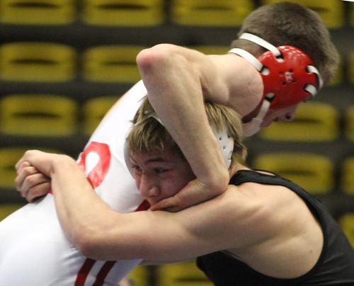 Rick Egan  | The Salt Lake Tribune 

Dane Nielson, Delta (white) wrestles Austin Dewey, Centennial,  in the160 lb division, in The Rocky Mountain Rumble wrestling tournament in Orem, Saturday, January 14, 2012.