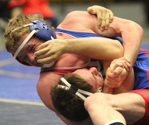 Rick Egan  | The Salt Lake Tribune 

Kyle Foy, Altamont, (left) wrestles Zach Coffman Tooele, (bottom) in the170 lb division, in The Rocky Mountain Rumble wrestling tournament in Orem, Saturday, January 14, 2012.