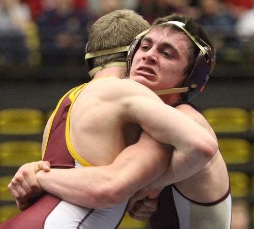 Rick Egan  | The Salt Lake Tribune 

Britain Carter, Maple Mountain, (right) wrestles Dusty Hone, Cedar, in the 113 lb division, in The Rocky Mountain Rumble wrestling tournament in Orem, Saturday, January 14, 2012.