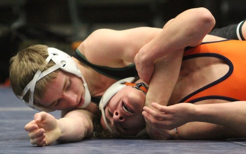 Rick Egan  | The Salt Lake Tribune 

Rami Haddadin Brighton (orange) wrestles Mitch Brown, Payson (black) in the 126 lb division, in The Rocky Mountain Rumble wrestling tournament in Orem, Saturday, January 14, 2012.