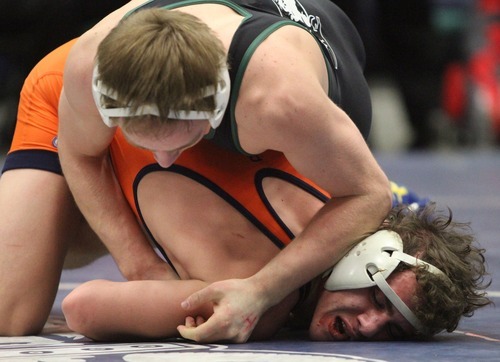 Rick Egan  | The Salt Lake Tribune
Rami Haddadin Brighton, orange, wrestles Mitch Brown, Payson, black, in the 126 lb division, in The Rocky Mountain Rumble wrestling tournament in Orem.