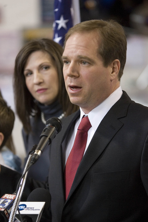Paul Fraughton | The Salt Lake Tribune.
David Kirkham, with wife Alisa, announces his run for governor at his motor sports business in Provo on Wednesday, Jan. 18, 2012.