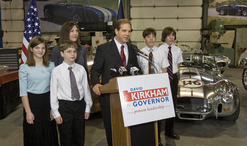 Paul Fraughton | The Salt Lake Tribune
David Kirkham -- surrounded by his wife, Alisa, and their four children, Emily, 12, Josh, 11, and twin sons Chris and Nick, 15, at his motor sports business in Provo -- announces his run for governor on Wednesday, Jan. 18, 2012.