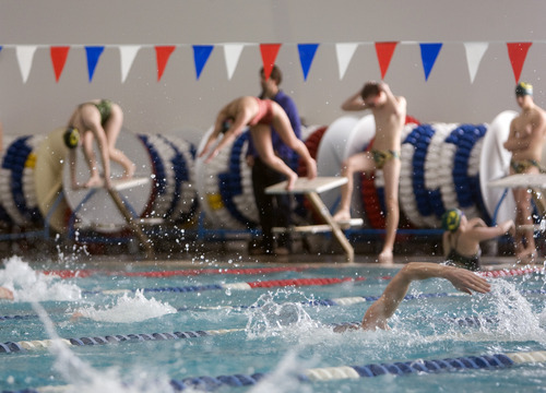 Kim Raff |The Salt Lake Tribune
Swimmers participate in a drill during Kearns High School swim practice at the Kearns Oquirrh Park Fitness Center's new swim facility in Kearns, Utah on January 12, 2012.