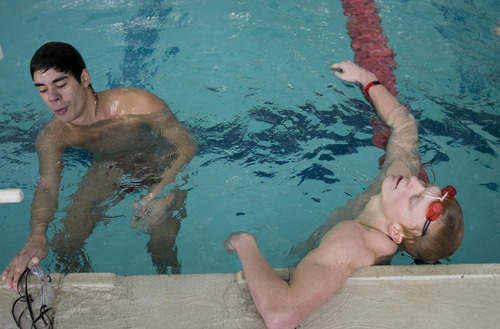 Kim Raff |The Salt Lake Tribune
(left) Eric Garcia and Kevin Anderson take a breather during Kearns High School swim practice at the Kearns Oquirrh Park Fitness Center's new swim facility in Kearns, Utah on January 12, 2012.