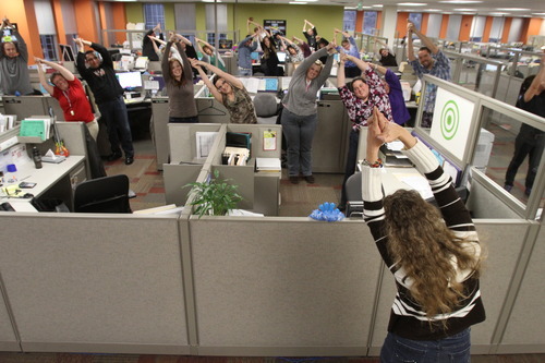 Rick Egan  | The Salt Lake Tribune 
CHG employees do their stretch exercises at their office in Salt Lake Thursday. CHG rose from 27th last year to 9th in Fortune's 2012 list of top 100 businesses to work for.