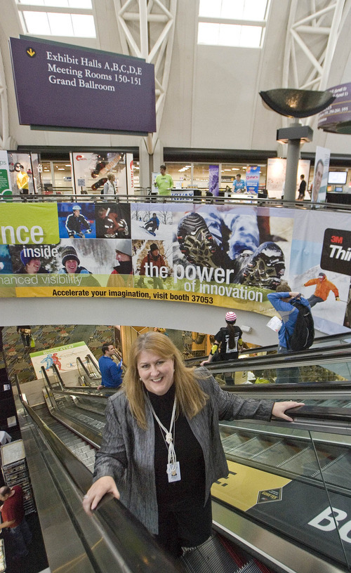 Paul Fraughton | The Salt Lake Tribune.
Allyson Jackson rides up the escalator at the Salt Palace Convention Center, all decked out for this week's Outdoor Retailer trade show. She is leaving Utah after 13 years overseeing operations at the Salt Palace and South Towne Exposition Center in Sandy.
