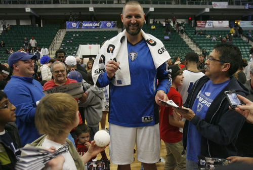 Rick Egan  | The Salt Lake Tribune 

Greg Ostertag signs autographs on the court after the Texas Legends, basketball team, at Dr Pepper Arena in Frisco, Texas, Thursday, December 29, 2011.