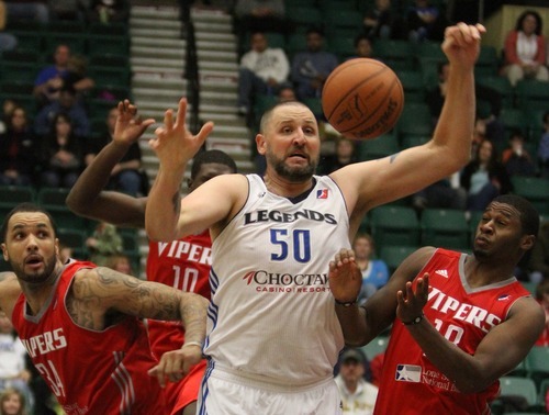 Rick Egan  | The Salt Lake Tribune 

Greg Ostertag (50) goes for a loose ball along with Vipers, Marcus Morris (34) and 	Kelvin Lewis (10) in NBA D League action,  Texas Legends Vs. The Rio Grande Valley Vipers, at Dr Pepper Arena in Frisco, Texas, Thursday, December 29, 2011.