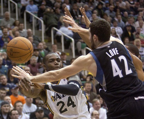 Jeremy Harmon  |  The Salt Lake Tribune

Paul Millsap passes the ball around Minnesota's Kevin Love and Wes Johnson as the Jazz host the Timberwolves at EnergySolutions Arena Saturday, Jan. 21, 2012 in Salt Lake City.