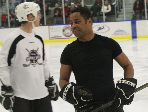 Rick Egan  | The Salt Lake Tribune 
Cuba Gooding Jr. striped off half of his uniform during Luc Robitaille's Celebrity Shoot Out hockey game benefitting Echoes of Hope at the Park City Ice Arena during the Sundance Film Festival Sunday.