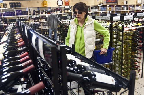 Photo by Chris Detrick | The Salt Lake Tribune 
Deborah Boede shops at the the Utah State Liquor Store at 402 East 6th Ave  Tuesday April 26, 2011. Nine Utah liquor stores targeted for closing this summer will stay open at least until February of next year. In addition, store operating hours will not be cut, and more than 100 liquor store employees, slated for layoffs, will keep their jobs.