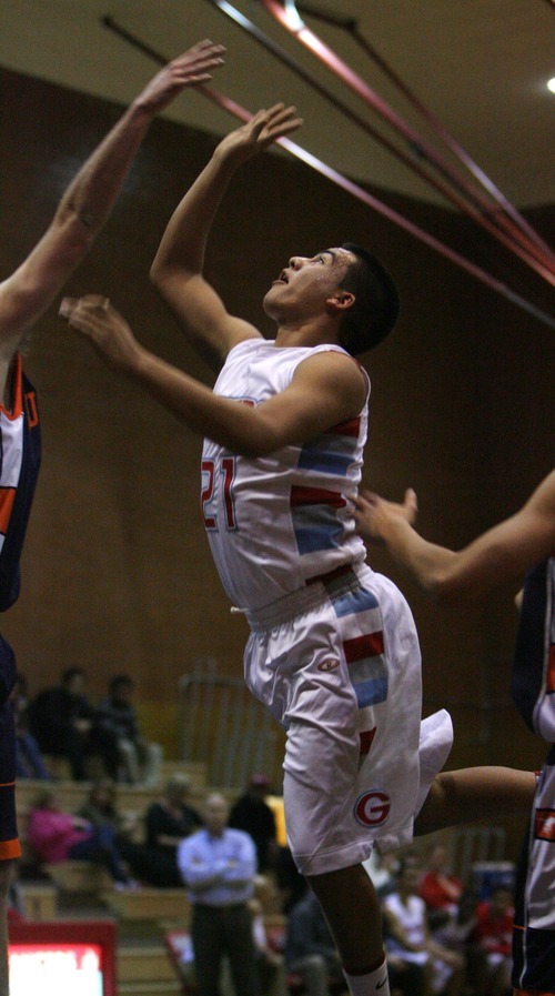 Steve Griffin  |  The Salt Lake Tribune

Granger's Mo Valladolid leaps for a rebound during game against Mt' Crest at Granger High School in West Valley City, Utah  Wednesday, January 4, 2012.