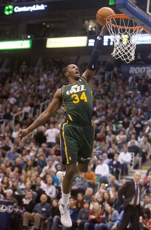 Jeremy Harmon  |  The Salt Lake Tribune

Utah's C.J. Miles (34) scores on a fast break as the Jazz face the 76ers at EnergySolutions Arena on Friday, December 30, 2011.
