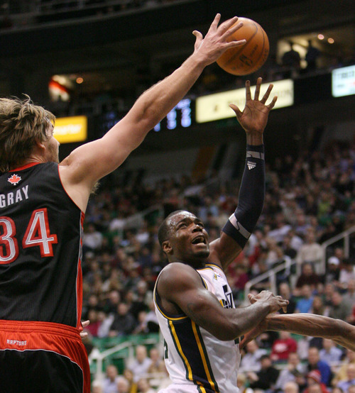 Steve Griffin  |  The Salt Lake Tribune


Utah's Paul Millsap flips the ball over the outstretched arm of Toronto's Aaron Gray during first half action in the Jazz versus Raptors game at EnergySolutions Arena in Salt Lake City, Utah  Wednesday, January 25, 2012.