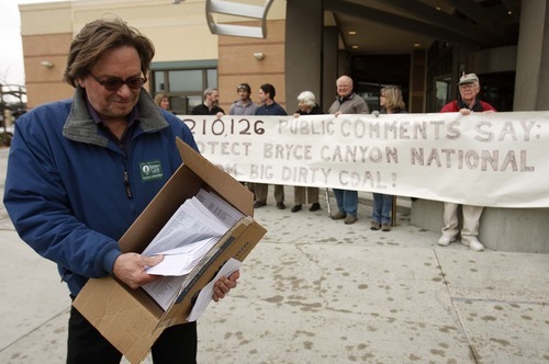 Leah Hogsten  |  The Salt Lake Tribune
Tim Wagner of the Sierra Club shows the 200,000-plus signatures from all 50 states submitted online protesting the Alton coal mine's expansion. The Sierra Club handed over the papers to the Bureau of Land Management state headquarters and conducted an hourlong rally outside Thursday, Jan. 26, 2012.