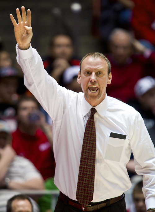 Utah Utes head coach Larry Krystkowiak signals his players against the Idaho State Bengals during the first half Friday, Dec. 16, 2011, in Salt Lake City, Utah. (© 2011 Douglas C. Pizac/Special to The Tribune)