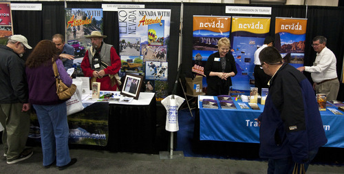 Chris Detrick  |  The Salt Lake Tribune
Participants look around at travel exhibits during the Morris Murdock Travel Expo at the South Towne Expo Center Friday January 27, 2012. Morris Murdock Travel Expo is the largest in state, with over 100 vendors.