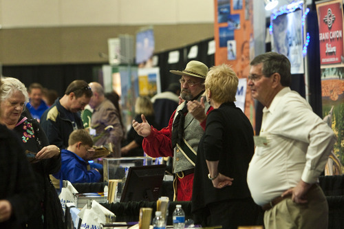 Chris Detrick  |  The Salt Lake Tribune
Participants look around at travel exhibits during the Morris Murdock Travel Expo at the South Towne Expo Center Friday January 27, 2012. Morris Murdock Travel Expo is the largest in state, with over 100 vendors.