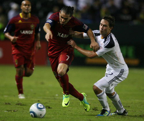 Kim Raff |  The Salt Lake Tribune
Real Salt Lake player Fabian Espindola is held back by LA Galaxy player Todd Dunivant during the first half of the Western Conference Championship at The Home Depot Center in Carson, CA on Sunday, November 6, 2011.
