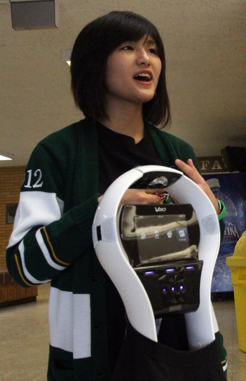 Rick Egan  | The Salt Lake Tribune
Kearns High School student Thao Nguyen talks on Thursday about the robot he and fellow Kearns students Zach Lester and Eric Mijanos raised funds for. The Kearns High OK Club raised $3,500 toward the donation of a VGo robot to Primary Children's Medical Center. The robot is able to attend class for a patient, relaying video of class in real-time and asking questions for the patient.